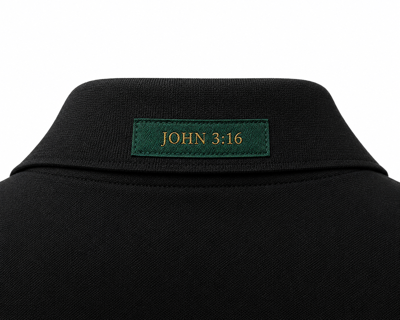 The Verse Polo™ in Graphite — back collar detail showing the Ordinary green verse patch, John 3:16