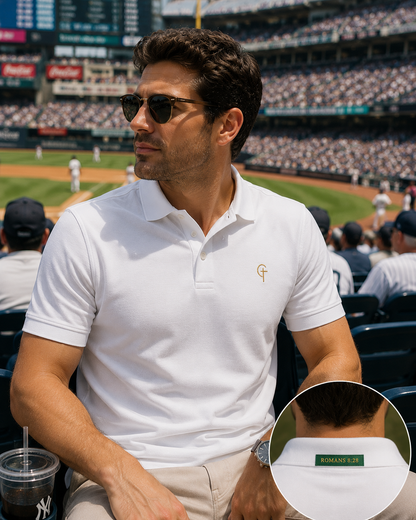 The Verse Polo™ in White — worn at a baseball stadium, with inset back collar detail showing Romans 8:28